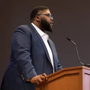 Author Tony Jack at the podium for the Inclusion in Action conference